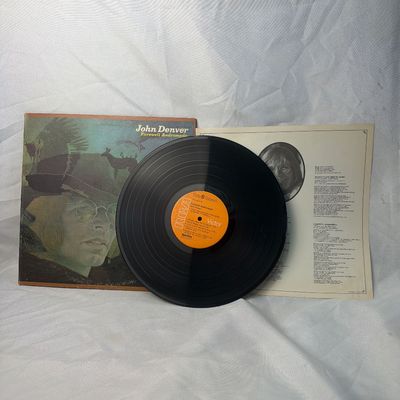Sale Photo Thumbnail #19: John Denver 'Farewell Andromeda' vinyl record album, released on RCA Victor (APL1-0101). Includes the original gatefold jacket, inner lyric sleeve, and the 12-inch vinyl LP. The vinyl shows some light surface wear and dust, and the jacket has minor edge w