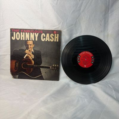 Sale Photo Thumbnail #29: Vintage vinyl record album of 'The Fabulous Johnny Cash' released by Columbia Records (Catalog CL 1253). Includes the original cardboard sleeve and the 12-inch LP record with red Columbia labels. The sleeve shows some wear, particularly along the edges an