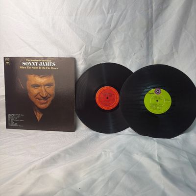 Sale Photo Thumbnail #55: A collection of vintage vinyl records featuring country music artist Sonny James, 'The Southern Gentleman'. Includes the album 'When The Snow Is On The Roses' with its original sleeve, alongside two 12-inch LP records (one with a red Columbia label and on