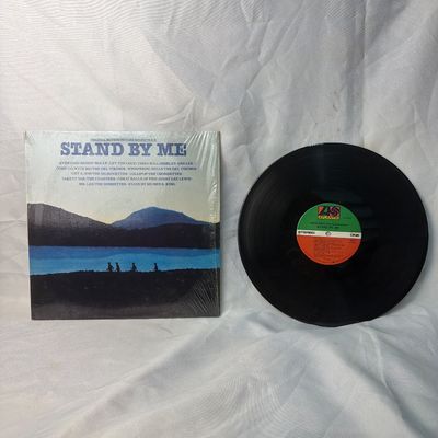 Sale Photo Thumbnail #39: Original Motion Picture Soundtrack for the film 'Stand By Me' on vinyl. Released on Atlantic Records. The outer sleeve remains in its original shrink wrap, showing some light storage wear. The vinyl record is included and appears to be in good pre-owned c