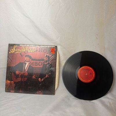 Sale Photo Thumbnail #13: Original soundtrack recording from the motion picture 'Songwriter' featuring Willie Nelson and Kris Kristofferson. Released on Columbia Records. The vinyl record appears to be in good condition with minor surface dust. The outer sleeve retains its origina