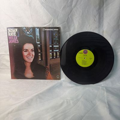 Sale Photo Thumbnail #57: Susan Raye "Willy Jones" vinyl LP record on Capitol Records (ST-736). Released in 1971, featuring the hit "L.A. International Airport". The cardboard sleeve shows some shelf wear, edge scuffs, and light discoloration on the back consistent with age. The v