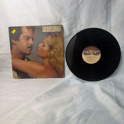 Sale Photo Thumbnail #47: Captain & Tennille 'Make Your Move' vinyl record album, released in 1979 on Casablanca Records. Includes the original album jacket and 12-inch vinyl LP. The jacket shows some light shelf wear and corner scuffs, and has a small yellow price sticker on the 