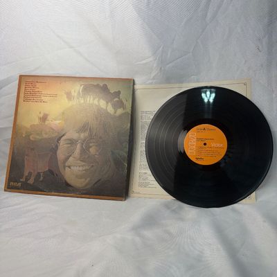 Sale Photo Thumbnail #20: John Denver 'Farewell Andromeda' vinyl record album, released on RCA Victor (APL1-0101). Includes the original gatefold jacket, inner lyric sleeve, and the 12-inch vinyl LP. The vinyl shows some light surface wear and dust, and the jacket has minor edge w
