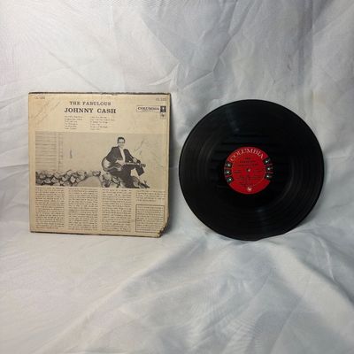 Sale Photo Thumbnail #30: Vintage vinyl record album of 'The Fabulous Johnny Cash' released by Columbia Records (Catalog CL 1253). Includes the original cardboard sleeve and the 12-inch LP record with red Columbia labels. The sleeve shows some wear, particularly along the edges an