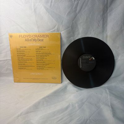 Sale Photo Thumbnail #62: Floyd Cramer - All of My Best vinyl record album. Released on RCA Special Products. Includes the original outer sleeve which remains partially in its original shrink wrap. The vinyl disc shows light surface wear from handling but appears to be in playable