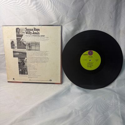 Sale Photo Thumbnail #58: Susan Raye "Willy Jones" vinyl LP record on Capitol Records (ST-736). Released in 1971, featuring the hit "L.A. International Airport". The cardboard sleeve shows some shelf wear, edge scuffs, and light discoloration on the back consistent with age. The v