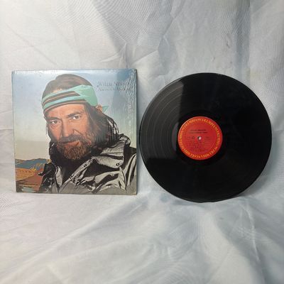 Sale Photo Thumbnail #25: Willie Nelson "Always On My Mind" vinyl record album on Columbia Records. Includes the original album jacket, which remains partially in its original shrink wrap. The vinyl disc features the classic red Columbia label. Shows light wear consistent with age