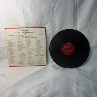 Sale Photo Thumbnail #71: Vintage 12-inch vinyl record album titled 'Firestone Presents Your Christmas Favorites Volume 7'. Features performances by Leontyne Price, Vikki Carr, John Gary, Nicolai Gedda, and the Vienna Choir Boys, conducted by Irwin Kostal. The cardboard sleeve sho