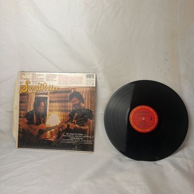 Sale Photo Thumbnail #14: Original soundtrack recording from the motion picture 'Songwriter' featuring Willie Nelson and Kris Kristofferson. Released on Columbia Records. The vinyl record appears to be in good condition with minor surface dust. The outer sleeve retains its origina