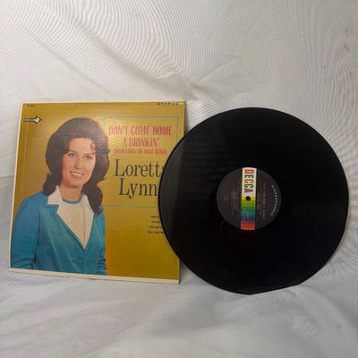 Sale Photo Thumbnail #3: Loretta Lynn - "Don't Come Home a Drinkin' (With Lovin' on Your Mind)" vinyl record album. Released on Decca Records (DL 74842) in stereophonic sound. Includes the original cardboard sleeve featuring cover art of Loretta Lynn. The vinyl disc shows some li