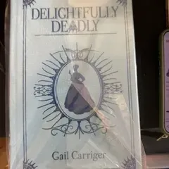 Hardcover copy of "Delightfully Deadly" by Gail Carriger, preserved in a protective plastic sleeve.