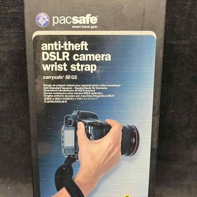 PacSafe Anti-Theft DSLR Camera Wrist Strap Sealed In Original Box