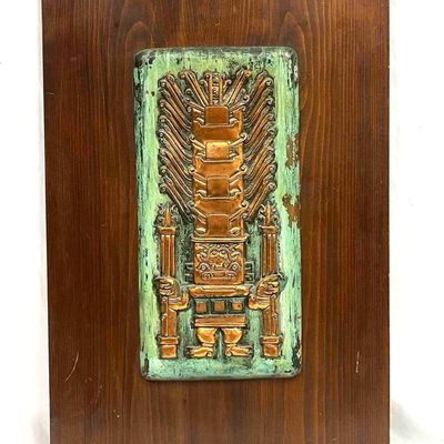 Copper Plaque With A Maya Totem Design Mounted On Dark Wooden Board