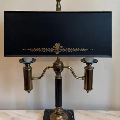 Vintage table lamp featuring black tole shade 