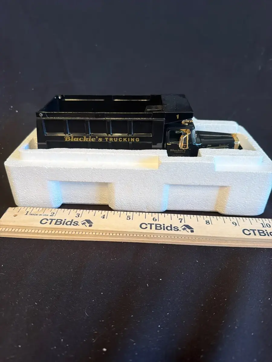 Blackie’s Trucking Diecast Dump Truck – Black & Gold
