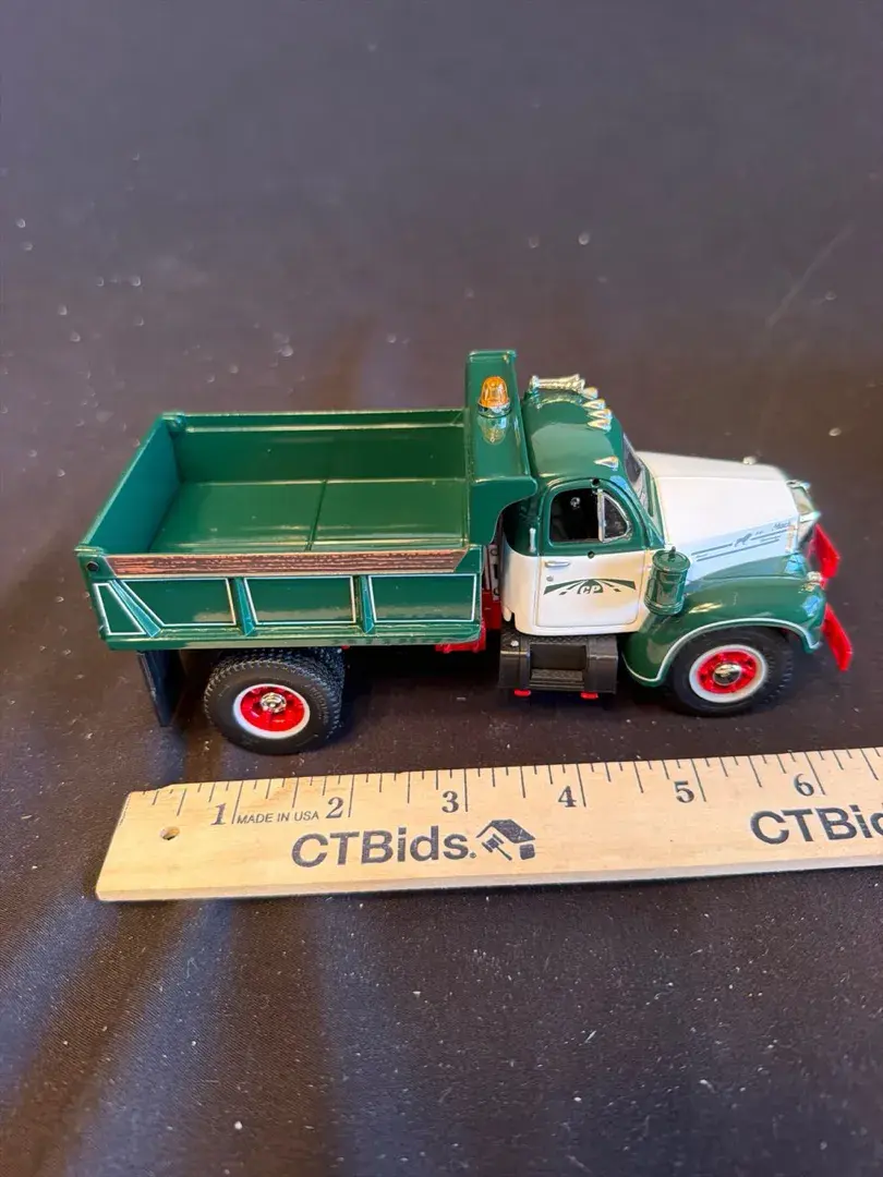 First Gear 1960 B-Model Mack Short Dump Truck die-cast metal replica in 1:34 scale. Features a green