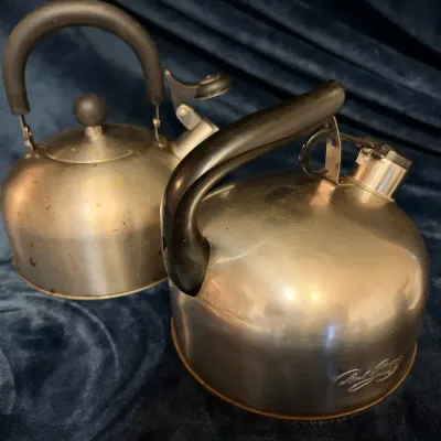 5-Pc Kitchen Lot: 2 Vintage Paul Revere Ware Tea Kettles, 1994 NOLA Tile Trivet, 2 Matte Black Napki