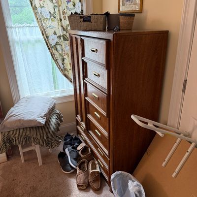 Vintage mid-century oak gentleman's chest featuring a side cabinet door and five drawers with brass pulls.