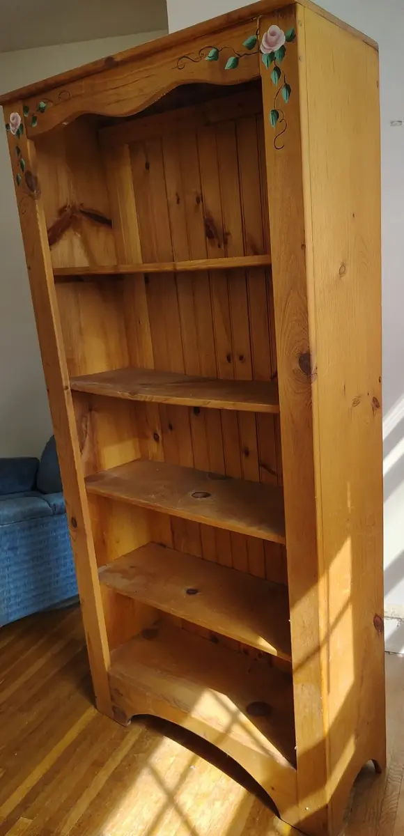 Tall Wooden Bookshelf With Floral Detail 