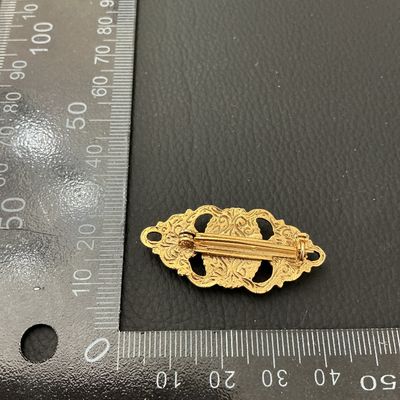 Vintage Gold-Tone Brooch with Faux Mother of Pearl and Blue Cabochons