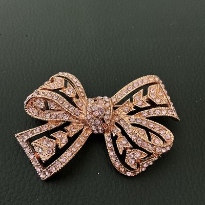 KJL Kenneth Jay Lane Rose Gold Tone Pink Rhinestone Bow Brooch