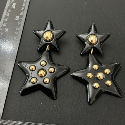 Vintage 1980s Black and Gold Tone Star Dangle Clip-On Earrings