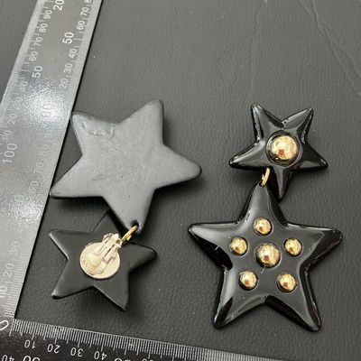 Vintage 1980s Black and Gold Tone Star Dangle Clip-On Earrings
