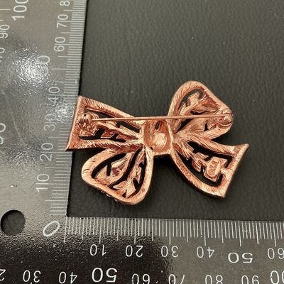 KJL Kenneth Jay Lane Rose Gold Tone Pink Rhinestone Bow Brooch