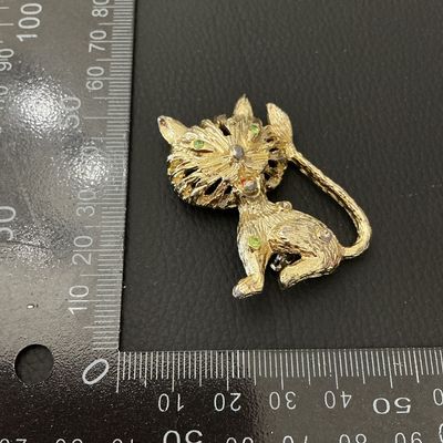 Vintage Gold Tone Textured Cat Brooch with Green Rhinestone Eyes