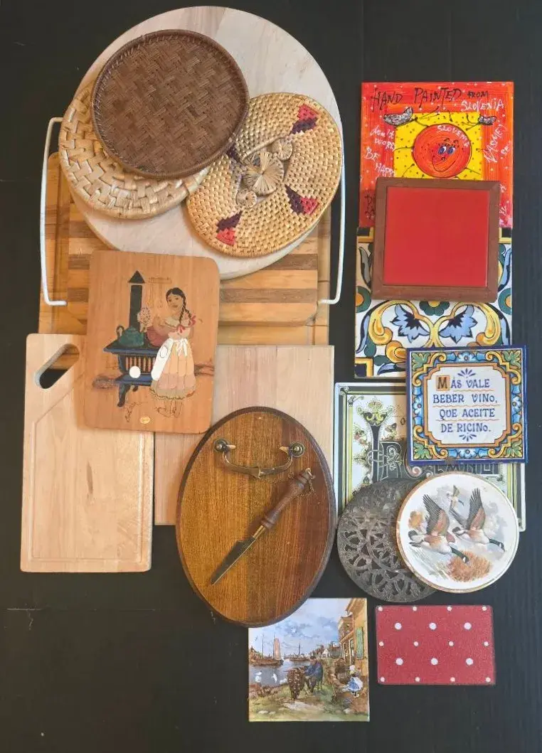 Collection Of Wood Cutting Boards And Variety Of Trivets With Vintage Cheese Board