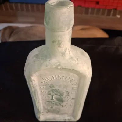 ANTIQUE BOTTLES WITH RAISED LETTERING