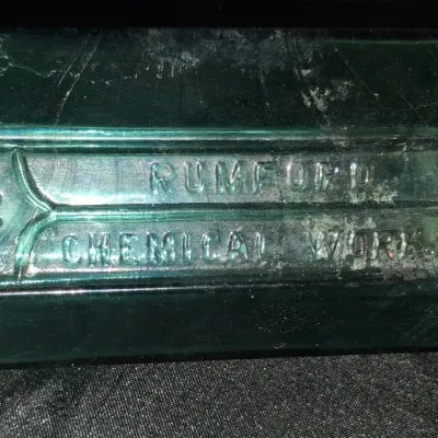 ANTIQUE BOTTLES WITH RAISED LETTERING