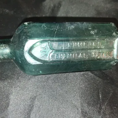 ANTIQUE BOTTLES WITH RAISED LETTERING