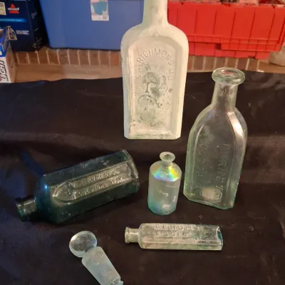 ANTIQUE BOTTLES WITH RAISED LETTERING