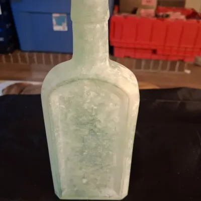 ANTIQUE BOTTLES WITH RAISED LETTERING