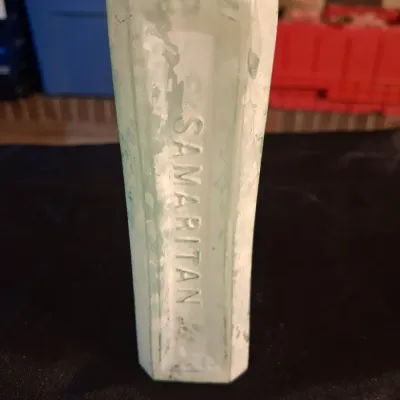 ANTIQUE BOTTLES WITH RAISED LETTERING