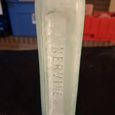 ANTIQUE BOTTLES WITH RAISED LETTERING