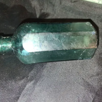 ANTIQUE BOTTLES WITH RAISED LETTERING
