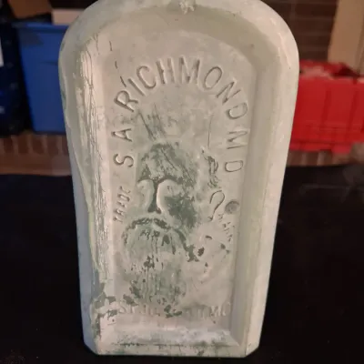 ANTIQUE BOTTLES WITH RAISED LETTERING