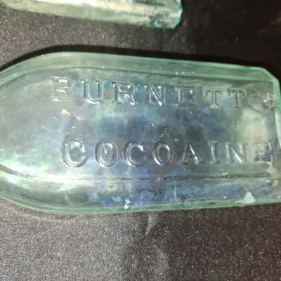 ANTIQUE BOTTLES WITH RAISED LETTERING