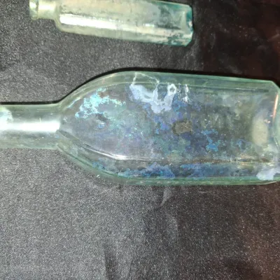 ANTIQUE BOTTLES WITH RAISED LETTERING