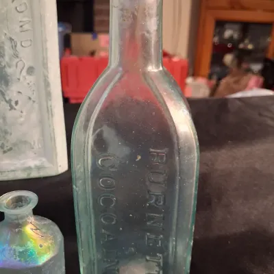 ANTIQUE BOTTLES WITH RAISED LETTERING