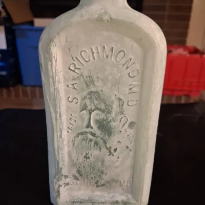 ANTIQUE BOTTLES WITH RAISED LETTERING