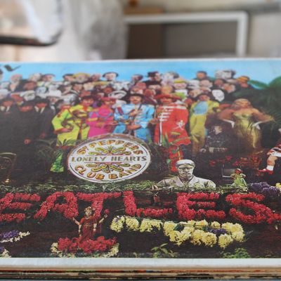 Vinyl album jacket for The Beatles' 'Sgt. Pepper's Lonely Hearts Club Band', featuring its iconic cover art and...