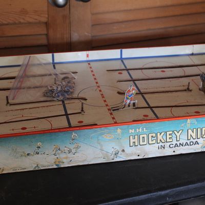 Vintage Eagle Toys NHL Hockey Night in Canada rod hockey game with tin player figures, showing light play wear.