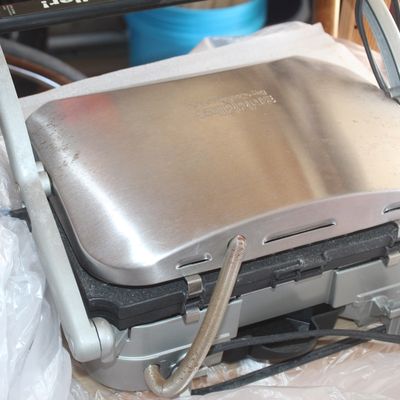 Cuisinart Griddler electric indoor grill and panini press with stainless steel housing.