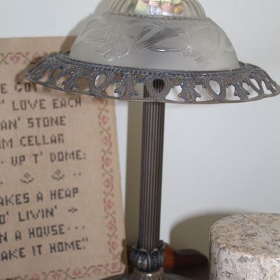 Vintage metal table lamp featuring a frosted and etched glass shade with pierced metal filigree trim.