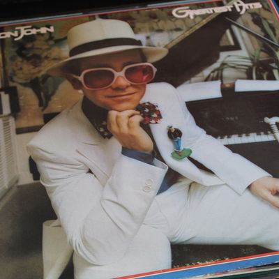 Vinyl LP copy of Elton John's Greatest Hits album, released in 1974, showing some light edge wear on the outer sleeve.