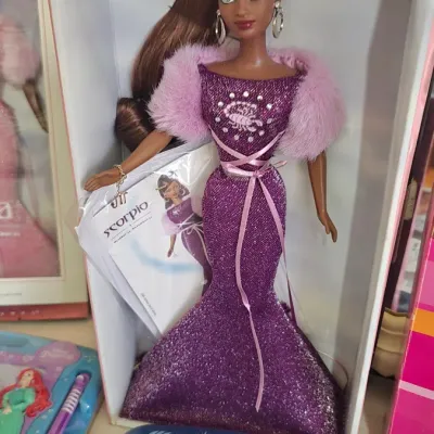 Mattel Barbie Essence of Nature Scorpio doll, new in box, featuring a purple glittery gown with faux fur trim.